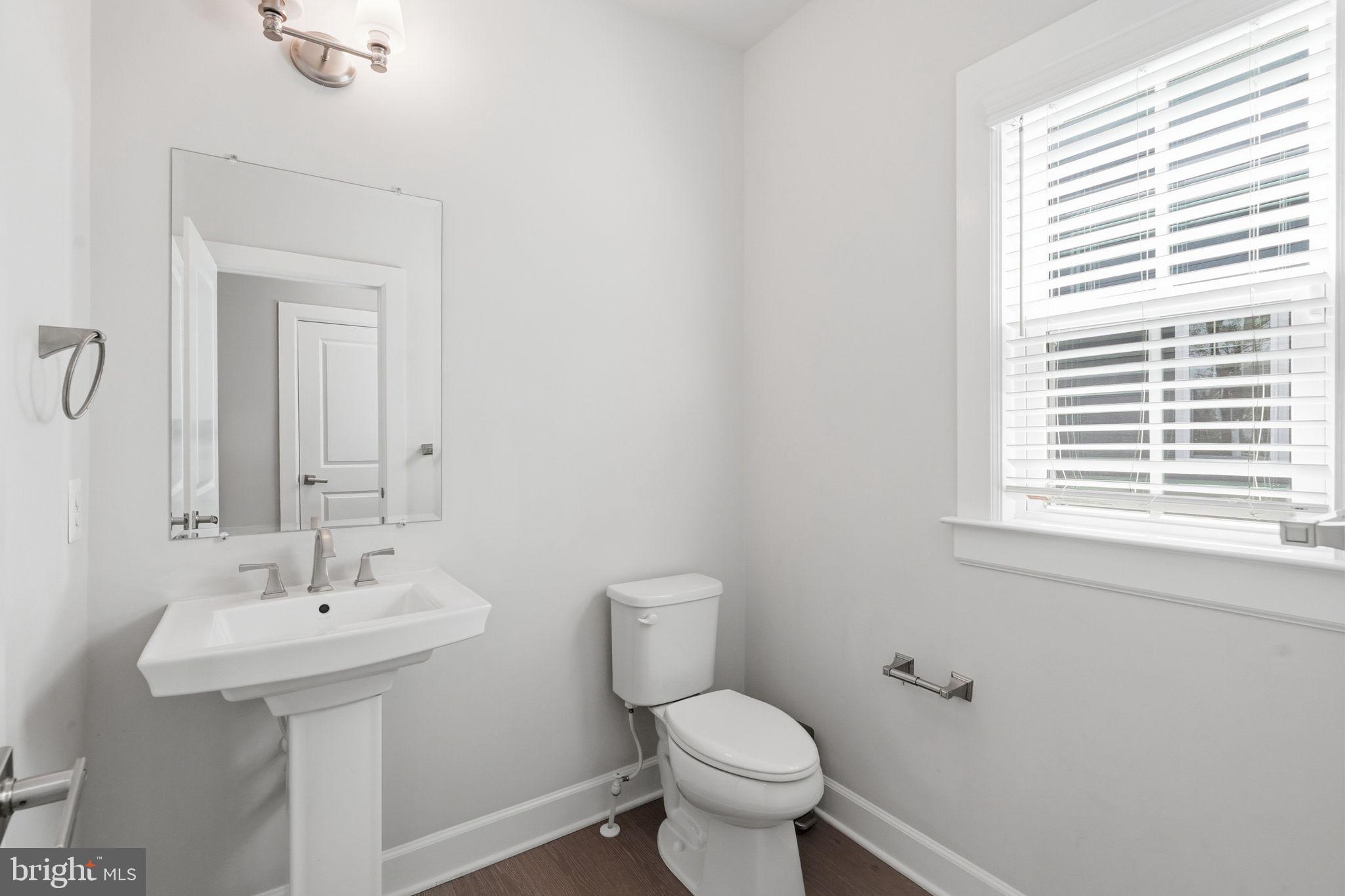 23648 Amesfield Place Aldie, VA 20105 - Photo 29 of 41 a bathroom with a sink a toilet and a mirror
