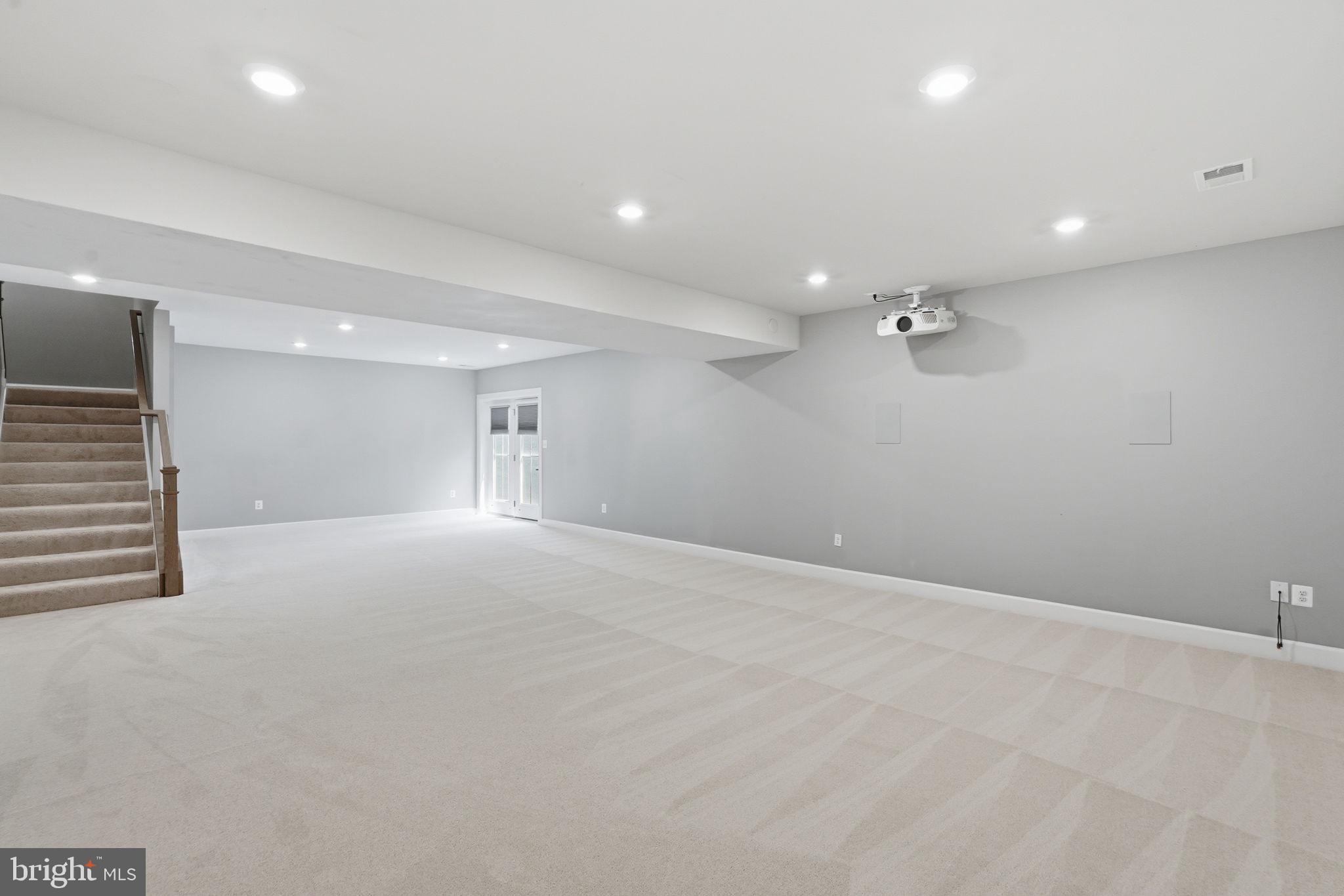 23648 Amesfield Place Aldie, VA 20105 - Photo 36 of 41 an empty room with a projector and bathroom