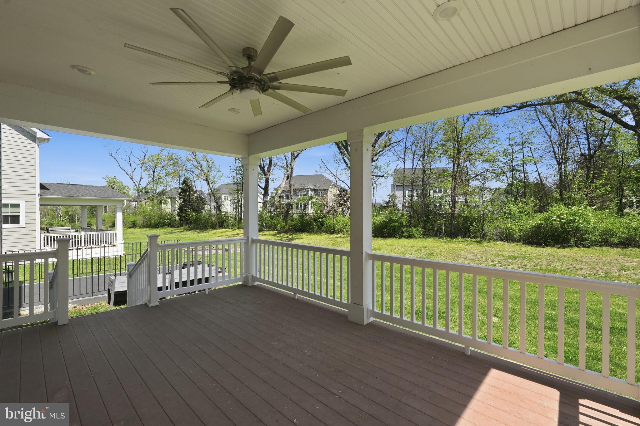 23648 Amesfield Place Aldie, VA 20105 - Photo 39 of 41 a view of a porch with wooden floor and iron fence