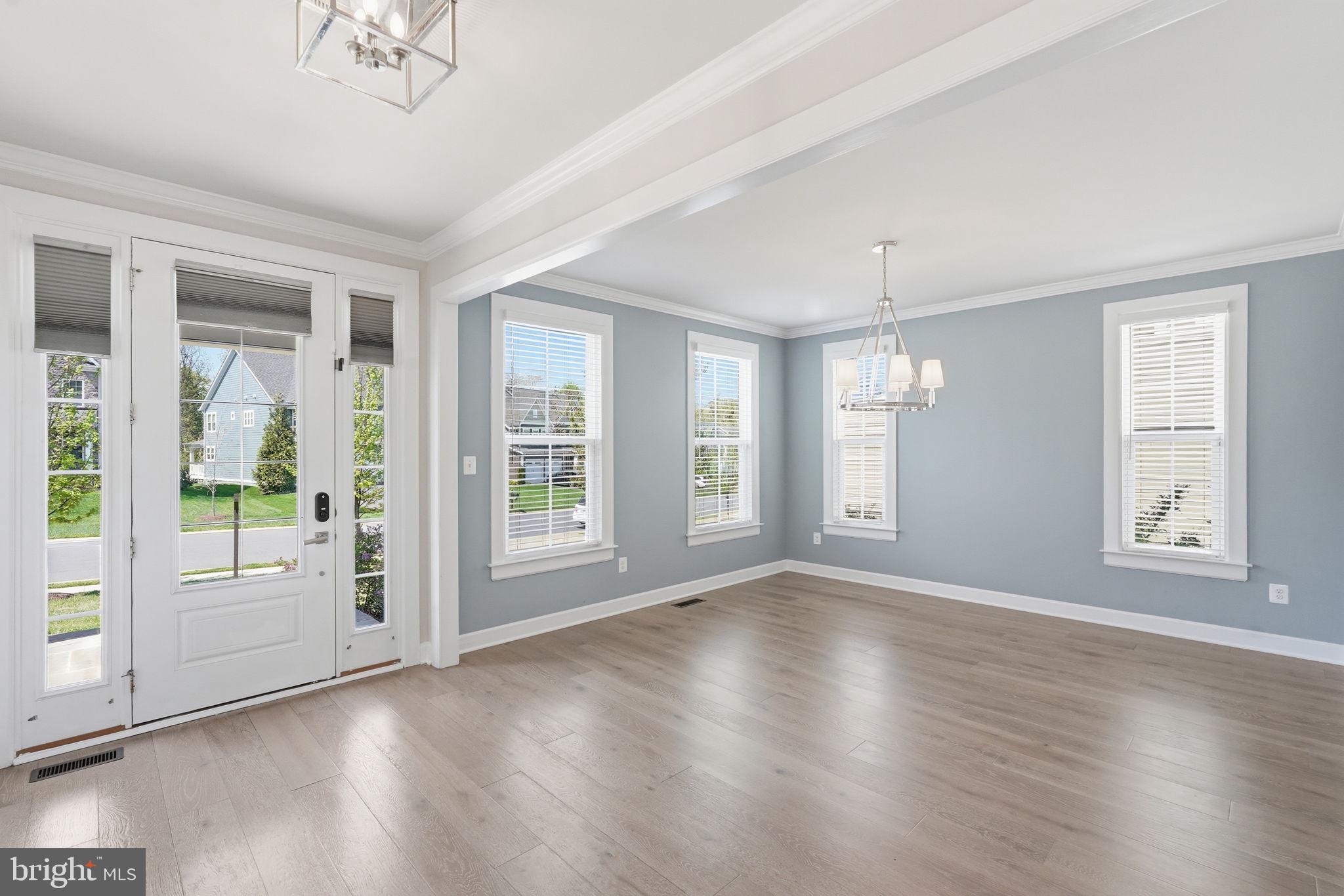 23648 Amesfield Place Aldie, VA 20105 - Photo 5 of 41 a view of an empty room with a window and wooden floor