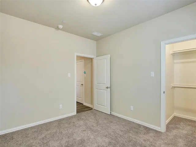 an empty room with closet area