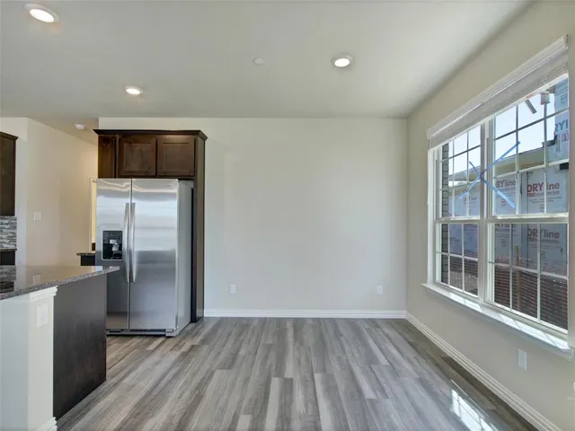 a view of a kitchen from the hallway