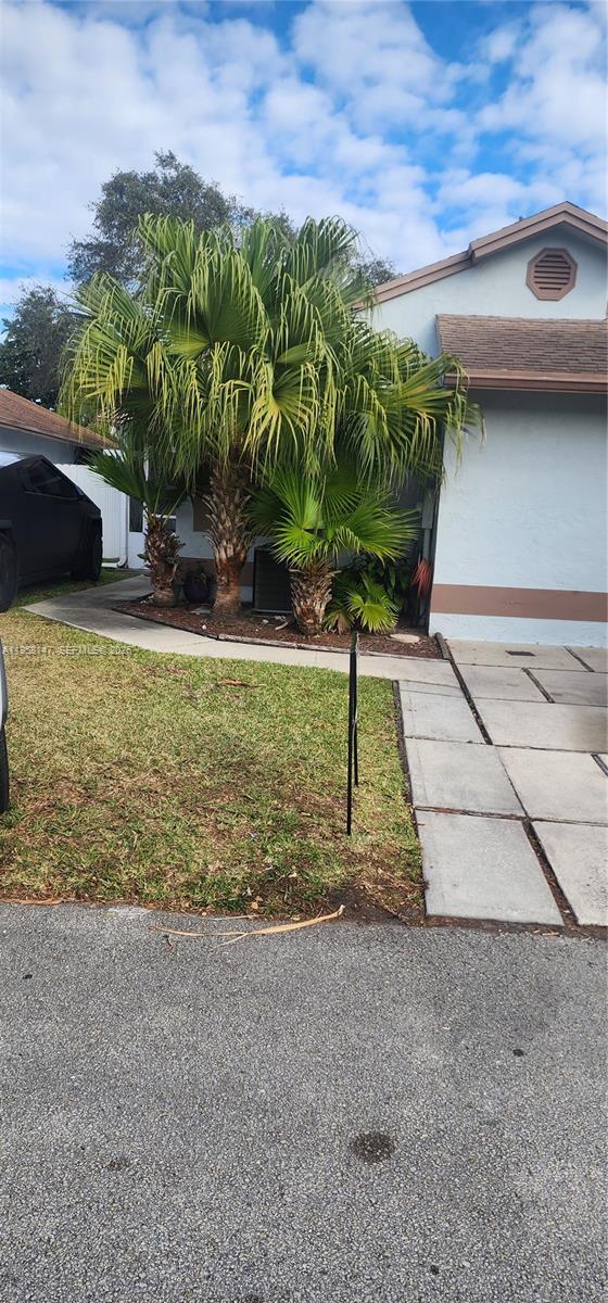 11021 Southwest 13th Street Pembroke Pines, FL 33025 - Photo 2 of 3 a view of a backyard