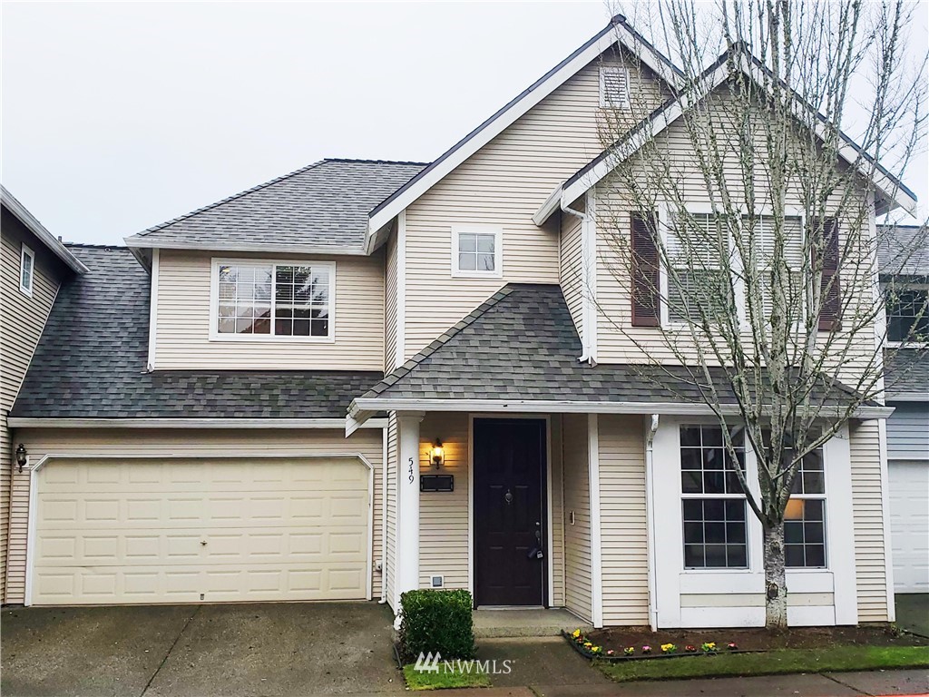 505 228th Avenue Northeast, Unit 5 Sammamish, WA 98074 - Photo 1 of 29 a front view of a house with a garden