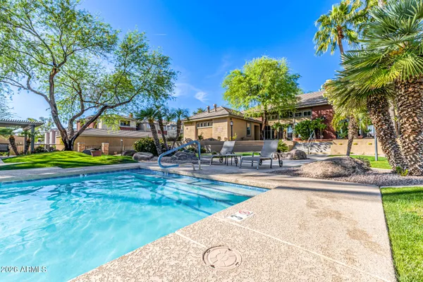 a view of a swimming pool with a patio