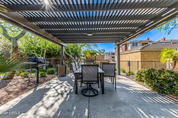 a view of a porch with furniture and a yard