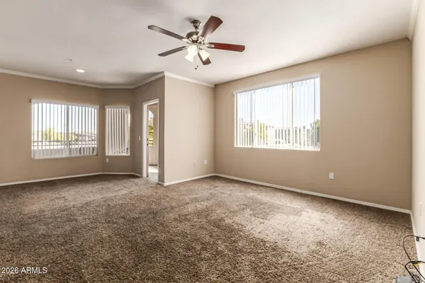 a view of an empty room with a window