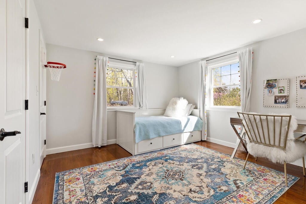 4 Crescent Road Hamilton, MA 01982 - Photo 16 of 29 a bedroom with a bed and wooden floor
