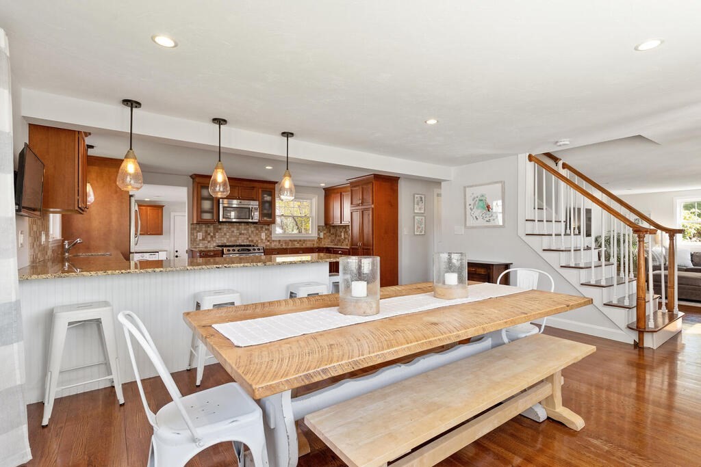 4 Crescent Road Hamilton, MA 01982 - Photo 6 of 29 a dining hall with stainless steel appliances kitchen island granite countertop a dining table and chairs