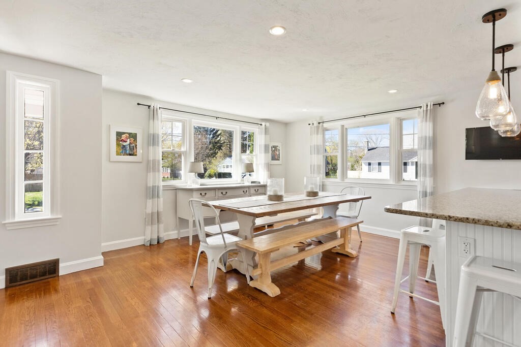 4 Crescent Road Hamilton, MA 01982 - Photo 9 of 29 a dining hall with stainless steel appliances granite countertop a stove and a wooden floors