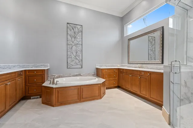 a bedroom with a large bed and a large window