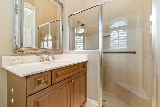 a view of a balcony with furniture and a floor to ceiling window