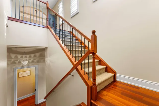 a view of a chairs and table in a balcony