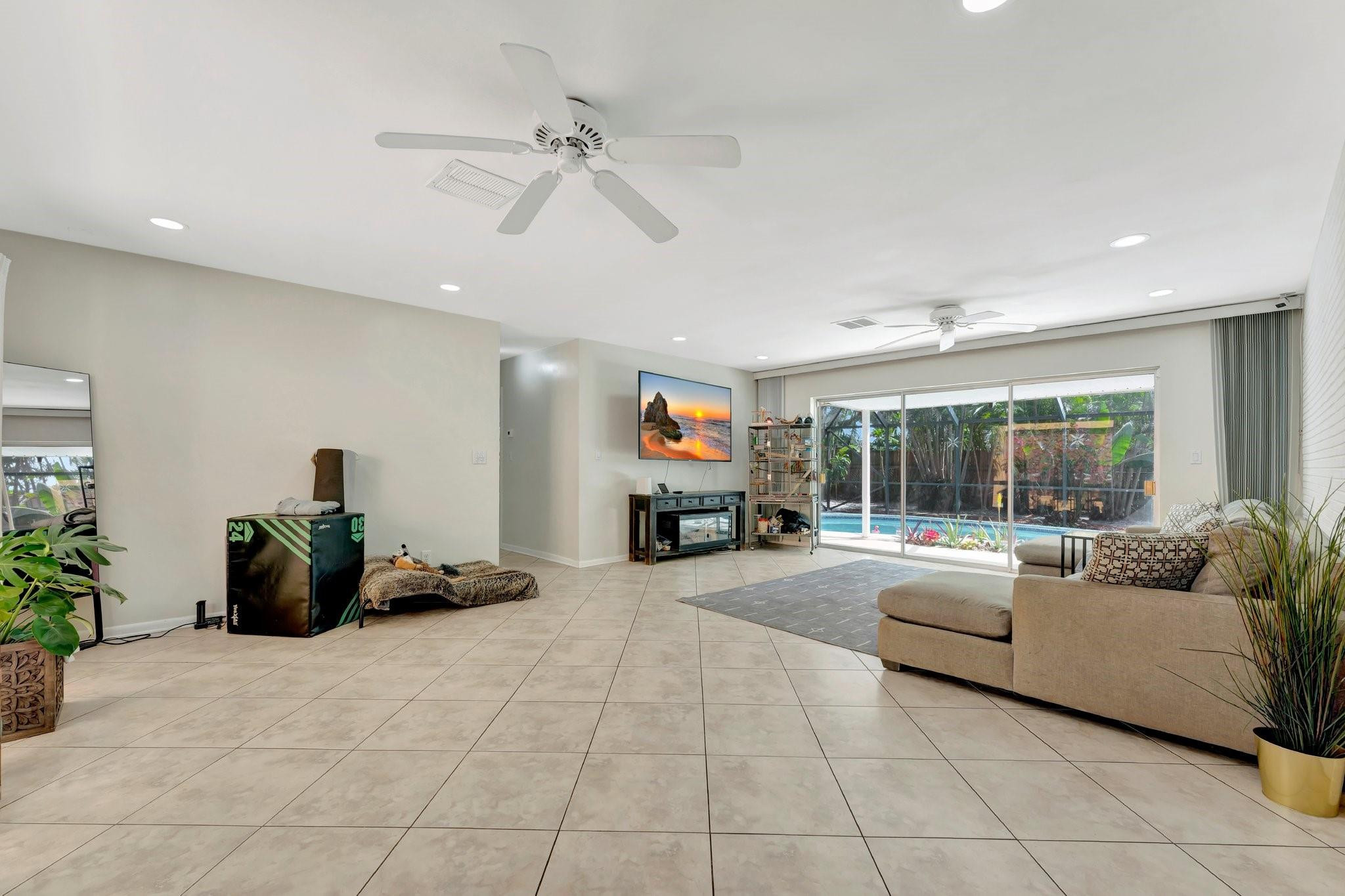 840 Southwest 3rd Street Boca Raton, FL 33486 - Photo 6 of 42 a living room with furniture and a large window