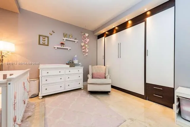 a room with a dresser and a mirror