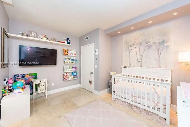 a view of living room with furniture and flat screen tv