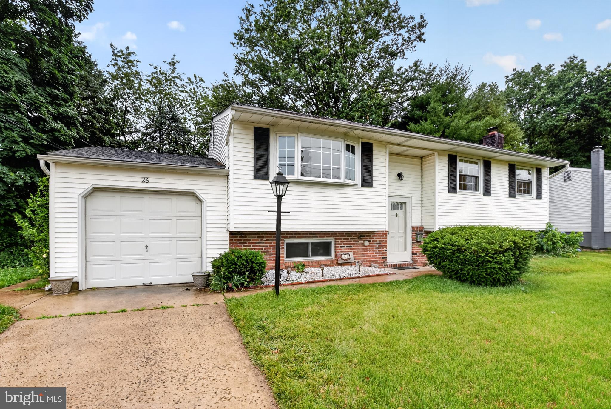 26 Glenwood Road Lumberton, NJ 08048 - Photo 2 of 37 Charming home with lush greenery.