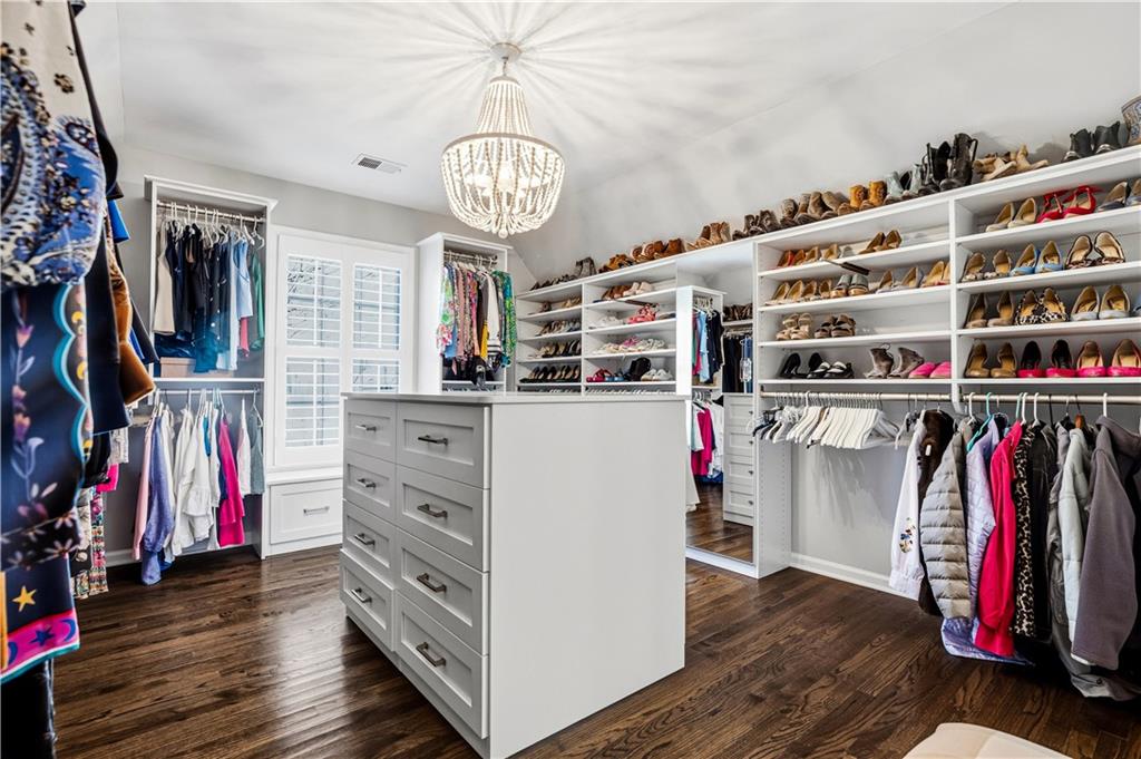 215 Woodchase Cl Northeast Atlanta, GA 30342 - Photo 37 of 53 a view of a kitchen with wooden floor and cabinets