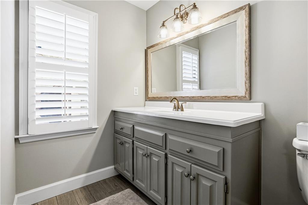 215 Woodchase Cl Northeast Atlanta, GA 30342 - Photo 38 of 53 a bathroom with a sink vanity and a mirror