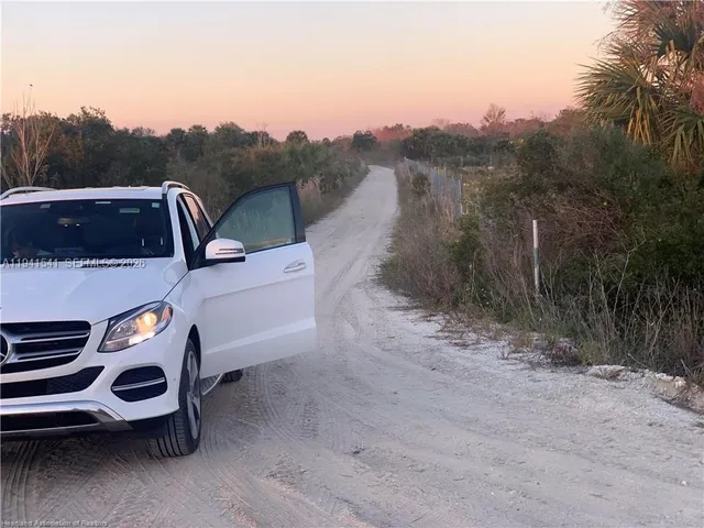 a view of a backyard with sitting area