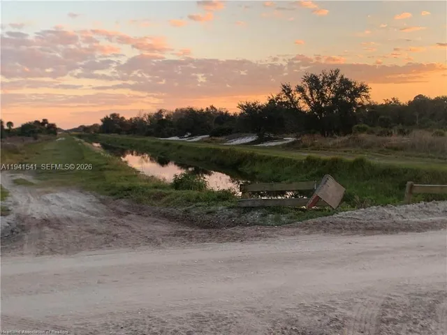 a view of a lake view with mountain in the background