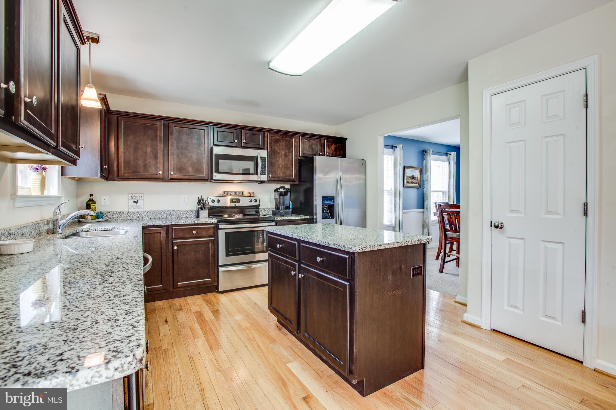 9060 Basil Road King George, VA 22485 - Photo 4 of 53 Wood Floors throughout Kitchen