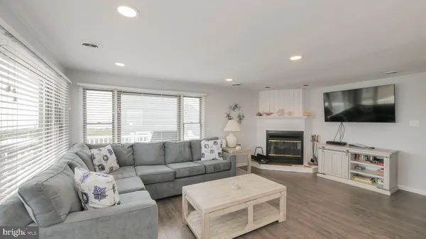 a living room with furniture or fireplace and a wooden floor