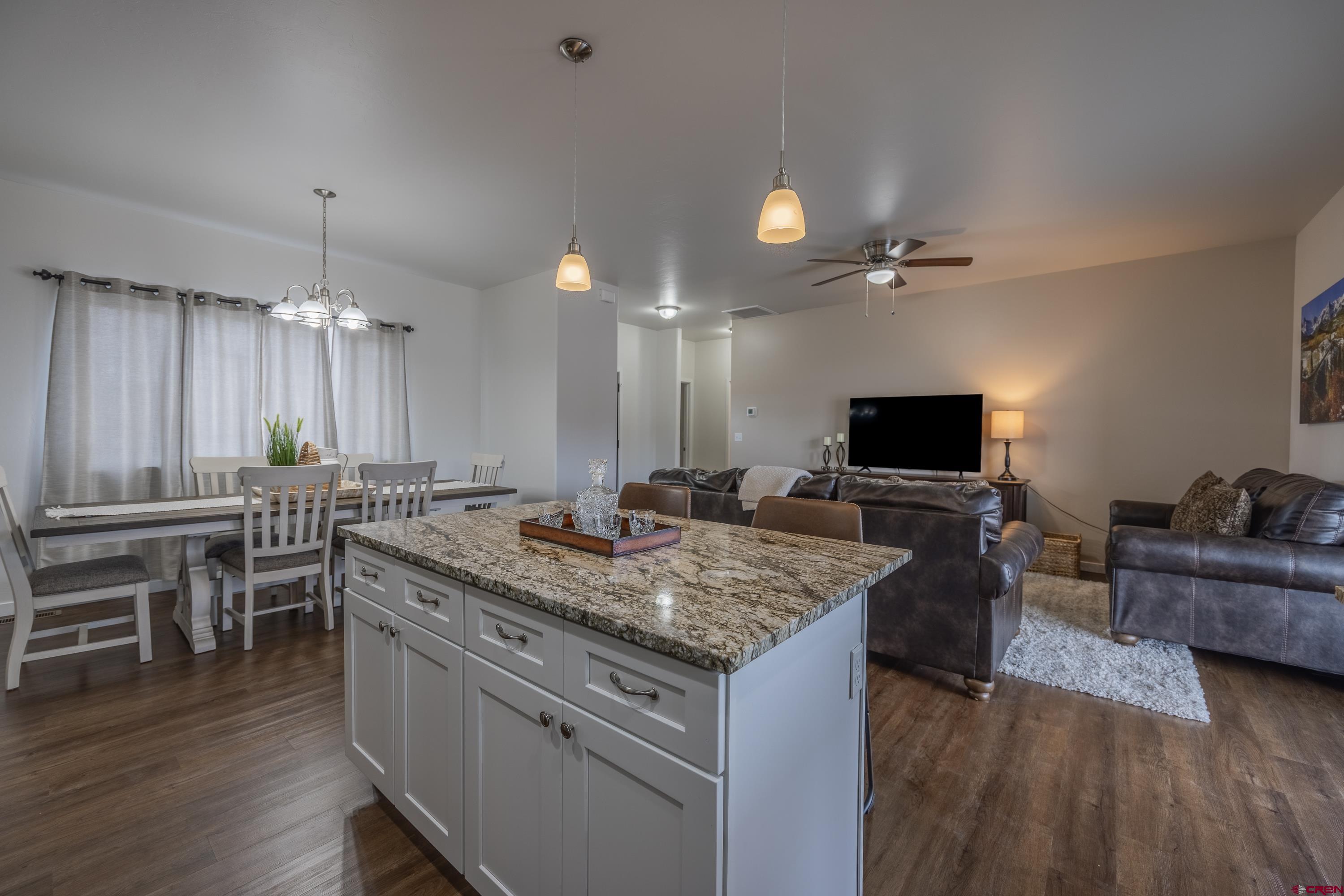 1725 Moonlight Drive Montrose, CO 81401 - Photo 16 of 35 a kitchen with a stove and a wooden floor