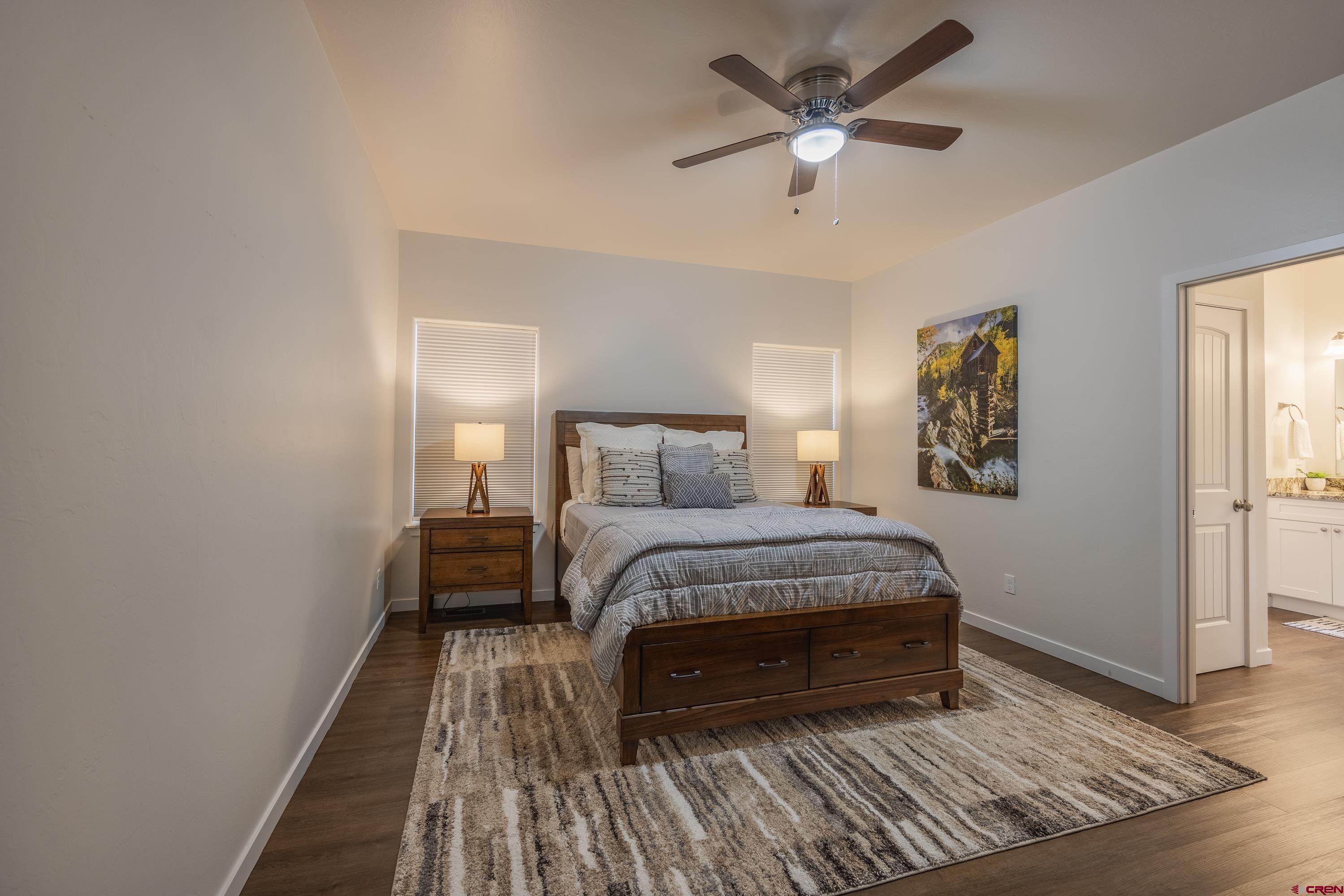 1725 Moonlight Drive Montrose, CO 81401 - Photo 17 of 35 a bedroom with a bed and window