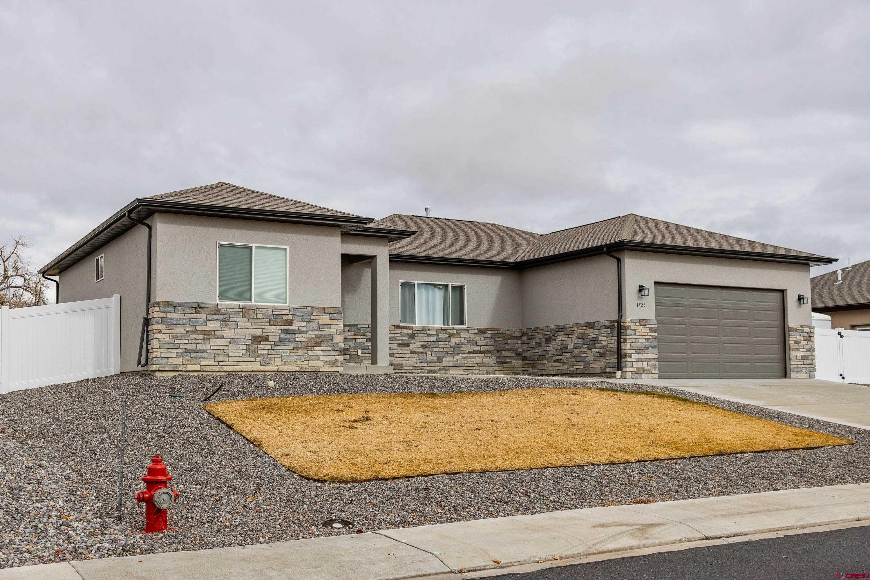 1725 Moonlight Drive Montrose, CO 81401 - Photo 2 of 35 a view of outdoor space yard and front view of house