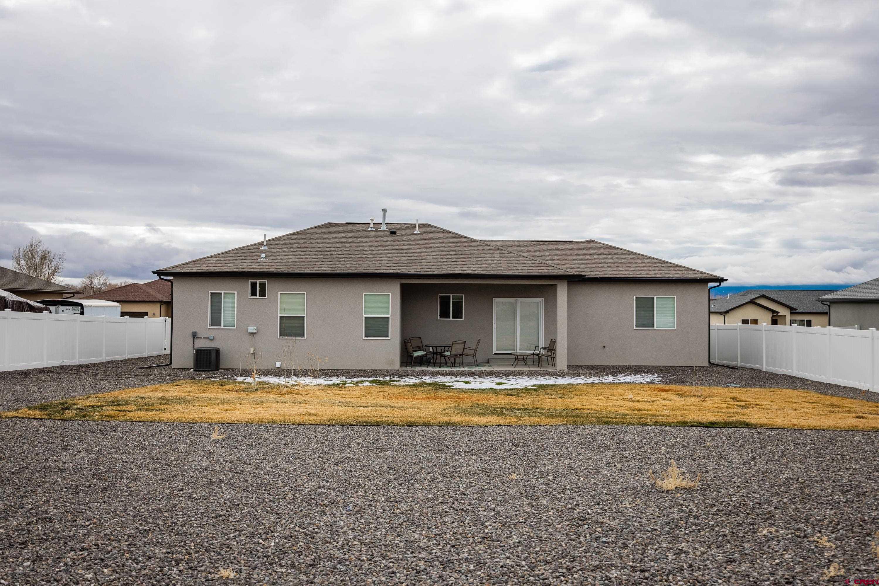 1725 Moonlight Drive Montrose, CO 81401 - Photo 33 of 35 a view of a house with pool and a yard