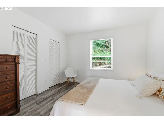 a bedroom with a bed and a closet