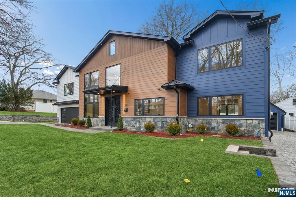292 Magnolia Avenue Cresskill, NJ 07626 - Photo 2 of 50 a front view of a house with garden