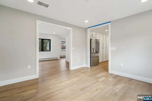 a view of a livingroom with wooden floor