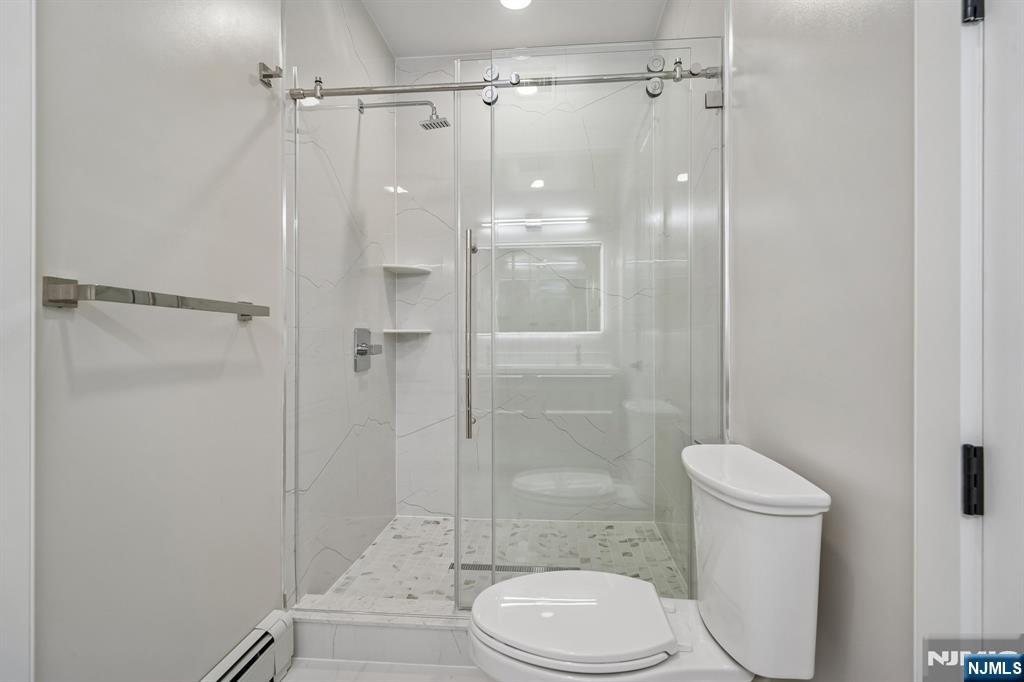 292 Magnolia Avenue Cresskill, NJ 07626 - Photo 37 of 50 a bathroom with a toilet and a shower