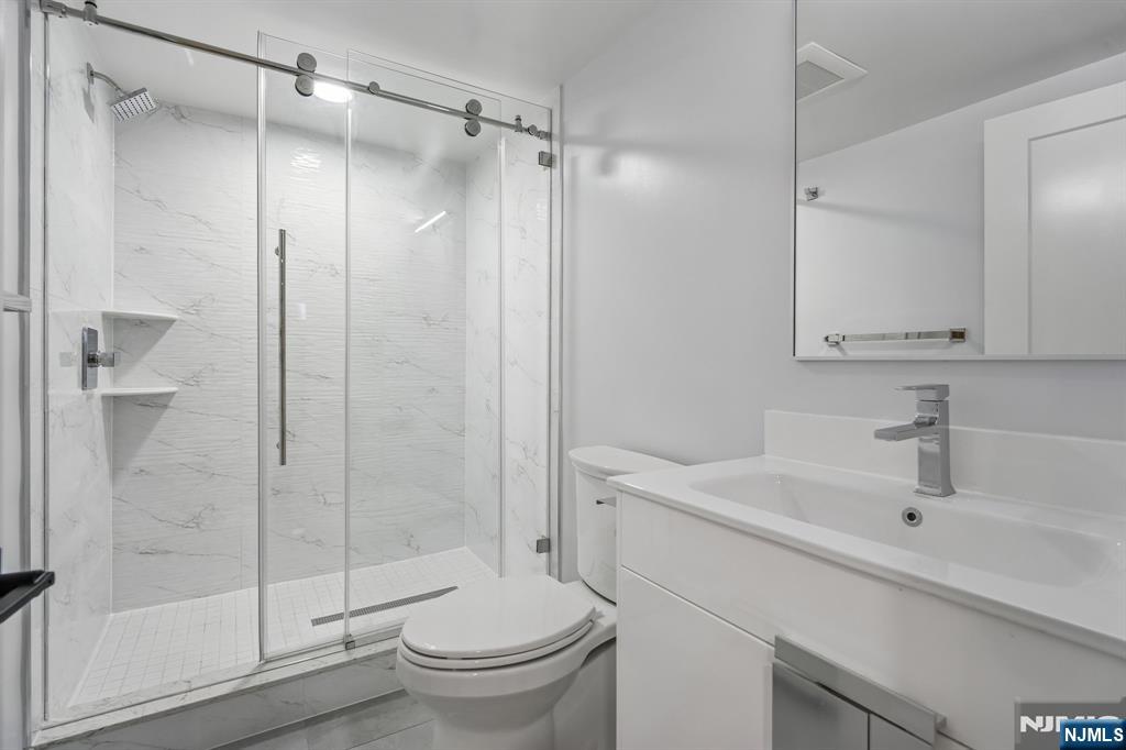 292 Magnolia Avenue Cresskill, NJ 07626 - Photo 45 of 50 a bathroom with a sink toilet and shower