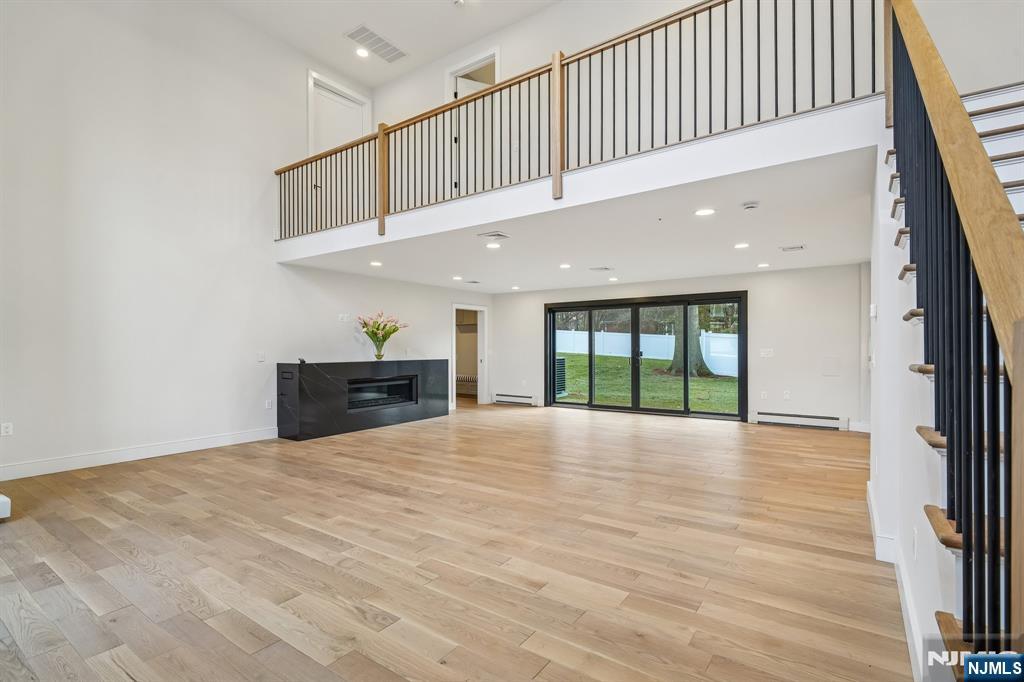 292 Magnolia Avenue Cresskill, NJ 07626 - Photo 5 of 50 a view of an empty room with wooden floor