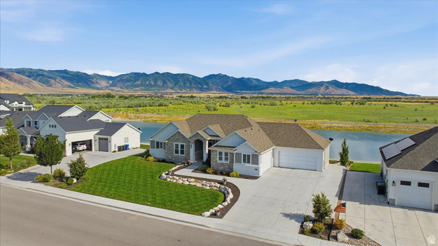 21 Pier Place Tooele, UT 84074 - Photo 3 of 112 Stone and siding exterior with a multi-car driveway and an attached garage