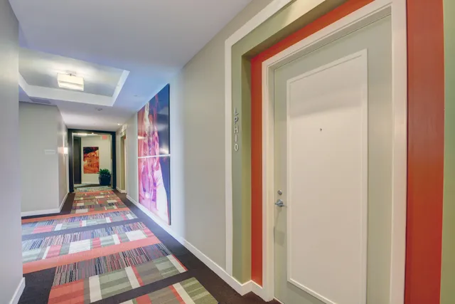 a view of a kitchen from the hallway