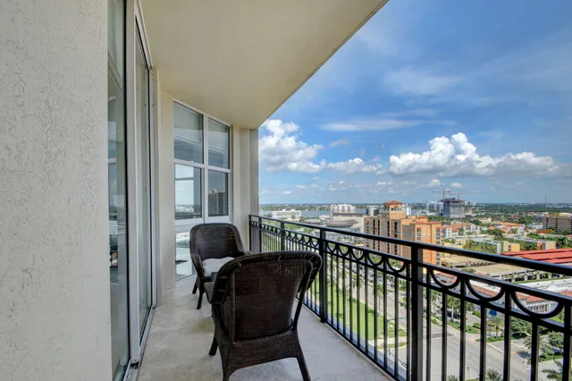 a balcony with furniture and a view