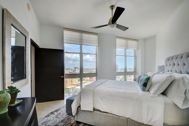 a view of a storage and utility room with washer and dryer