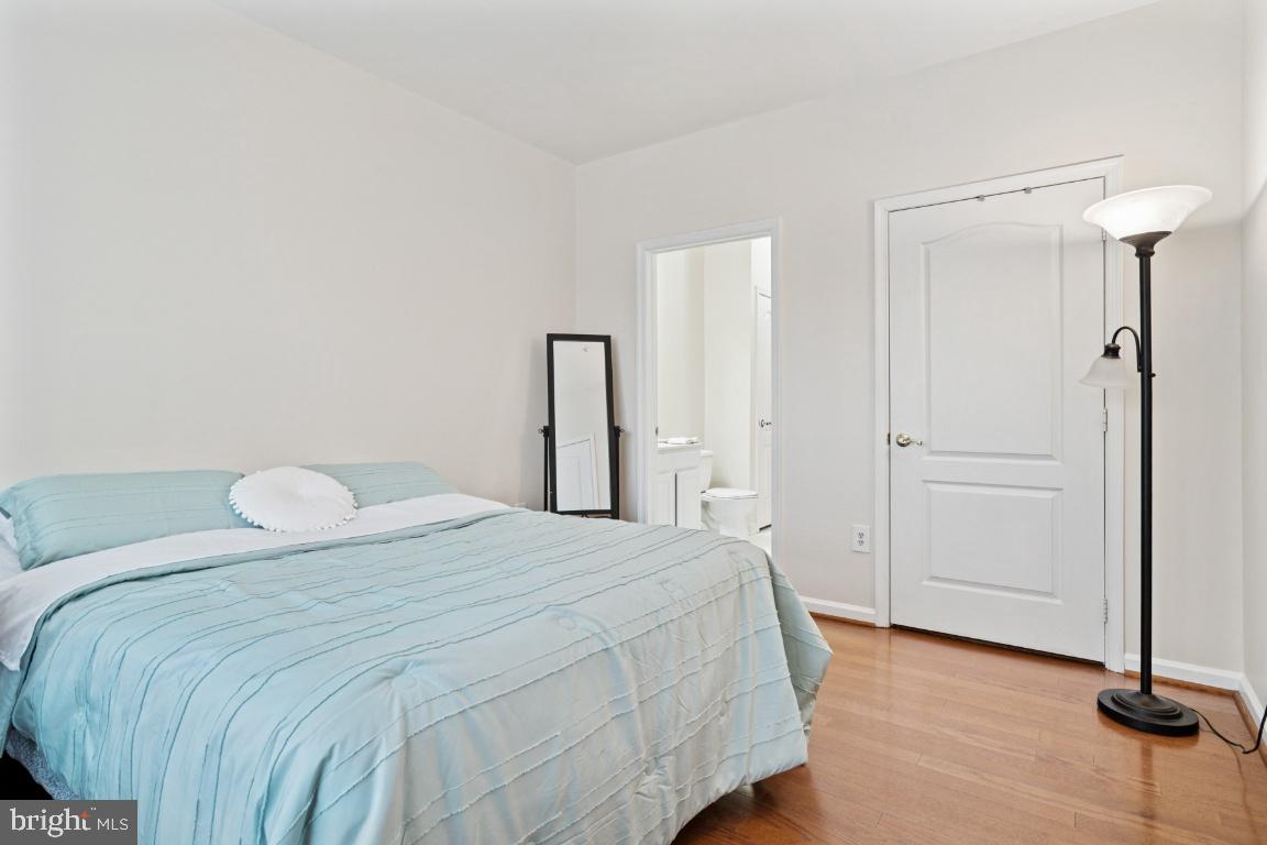20903 Cedarpost Square, Unit 101 Ashburn, VA 20147 - Photo 12 of 26 a bedroom with a bed and a closet
