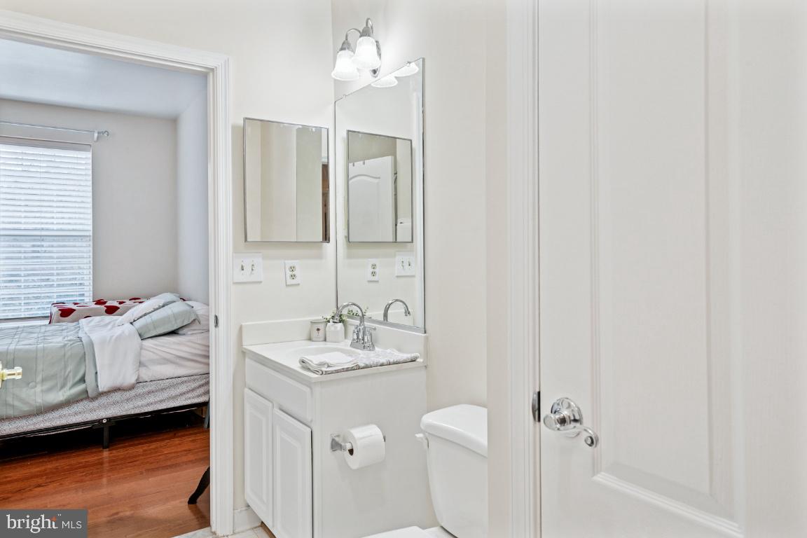 20903 Cedarpost Square, Unit 101 Ashburn, VA 20147 - Photo 15 of 26 a bathroom with a sink double vanity and tub