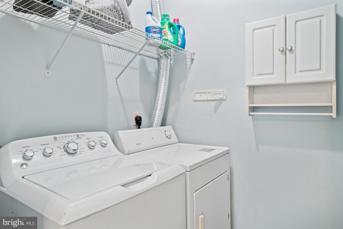 20903 Cedarpost Square, Unit 101 Ashburn, VA 20147 - Photo 21 of 26 a utility room with dryer and washer