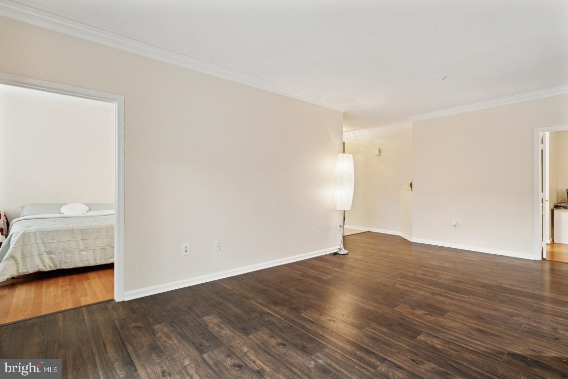 20903 Cedarpost Square, Unit 101 Ashburn, VA 20147 - Photo 7 of 26 a view of an empty room and wooden floor