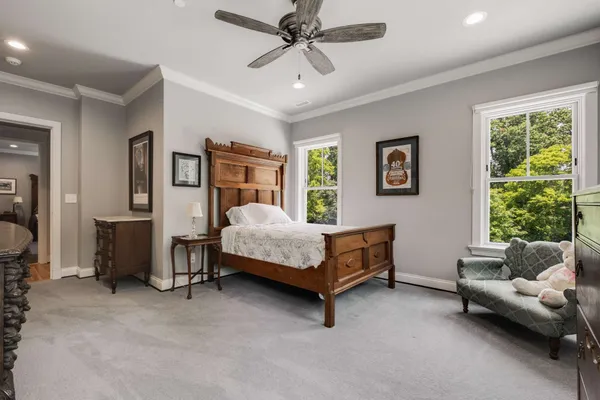 a bedroom with a bed and a couch