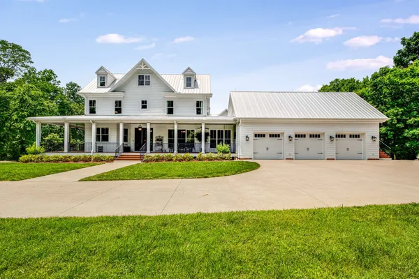 a view of house with yard and entertaining space