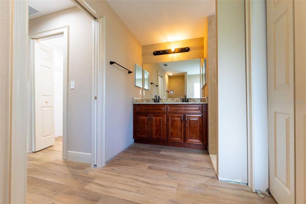 5845 Northwest 65th Street Ocala, FL 34482 - Photo 39 of 63 a view of a bathroom from the hallway