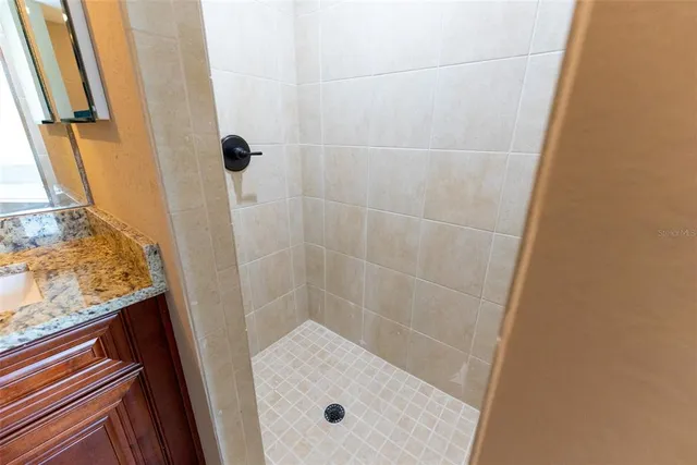 an empty room with wooden floor and window