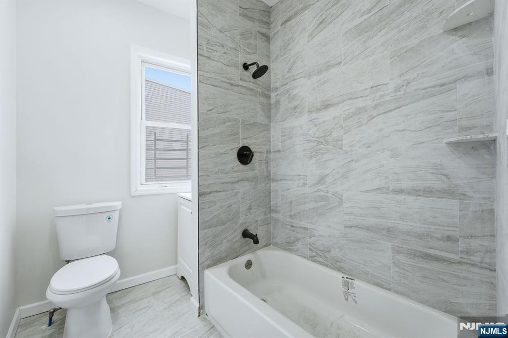72 South 13th Street Newark, NJ 07107 - Photo 12 of 40 a bathroom with a toilet and a shower
